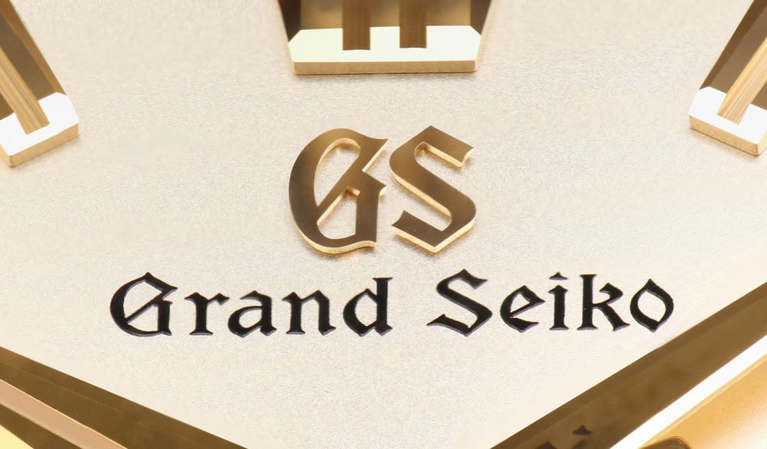 Grand Seiko SLGH002 dial detail of golden applied logo .