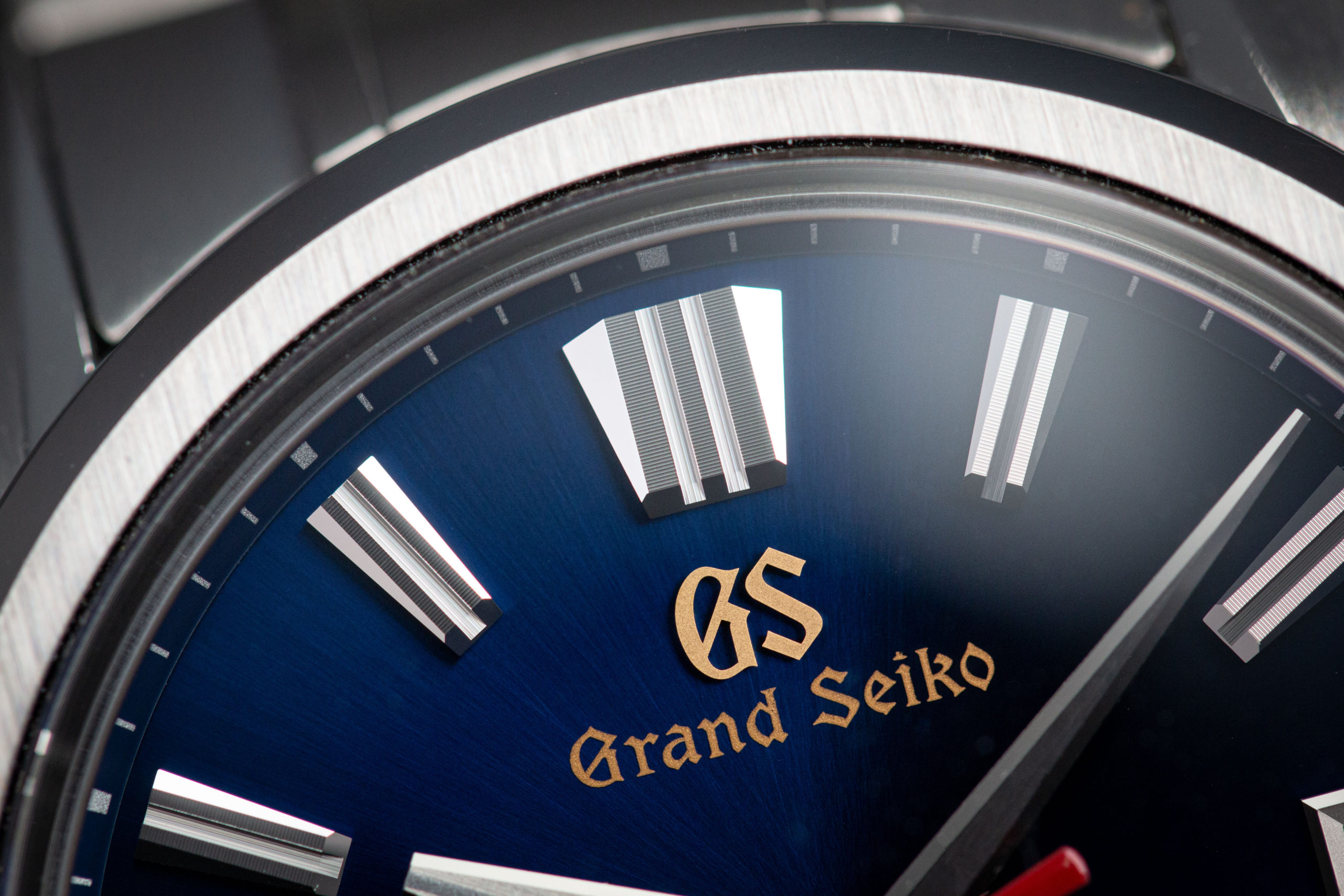 Macro detail of blue dial Grand Seiko SLGH003 wristwatch.