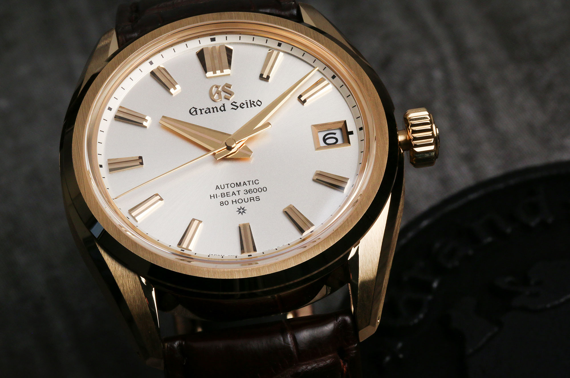 Grand Seiko SLGH002 with a gold case and light dial.