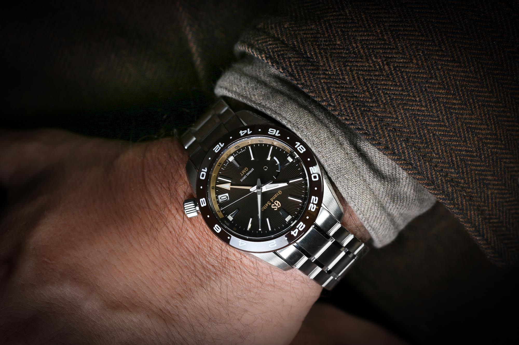 Grand Seiko SBGE263, a brown-dialed wristwatch in the wrist.