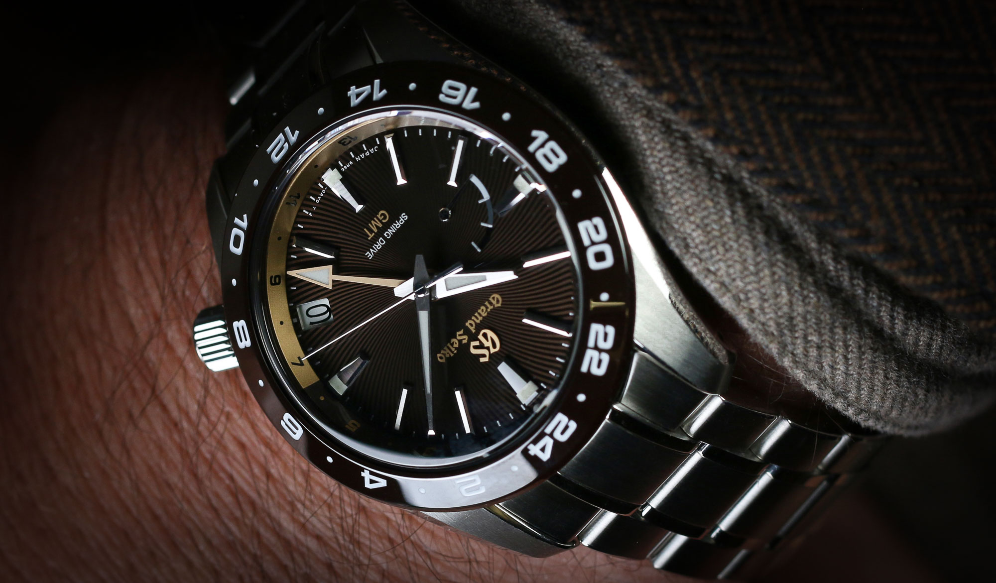 Grand Seiko SBGE263, a brown-dialed wristwatch in the wrist.