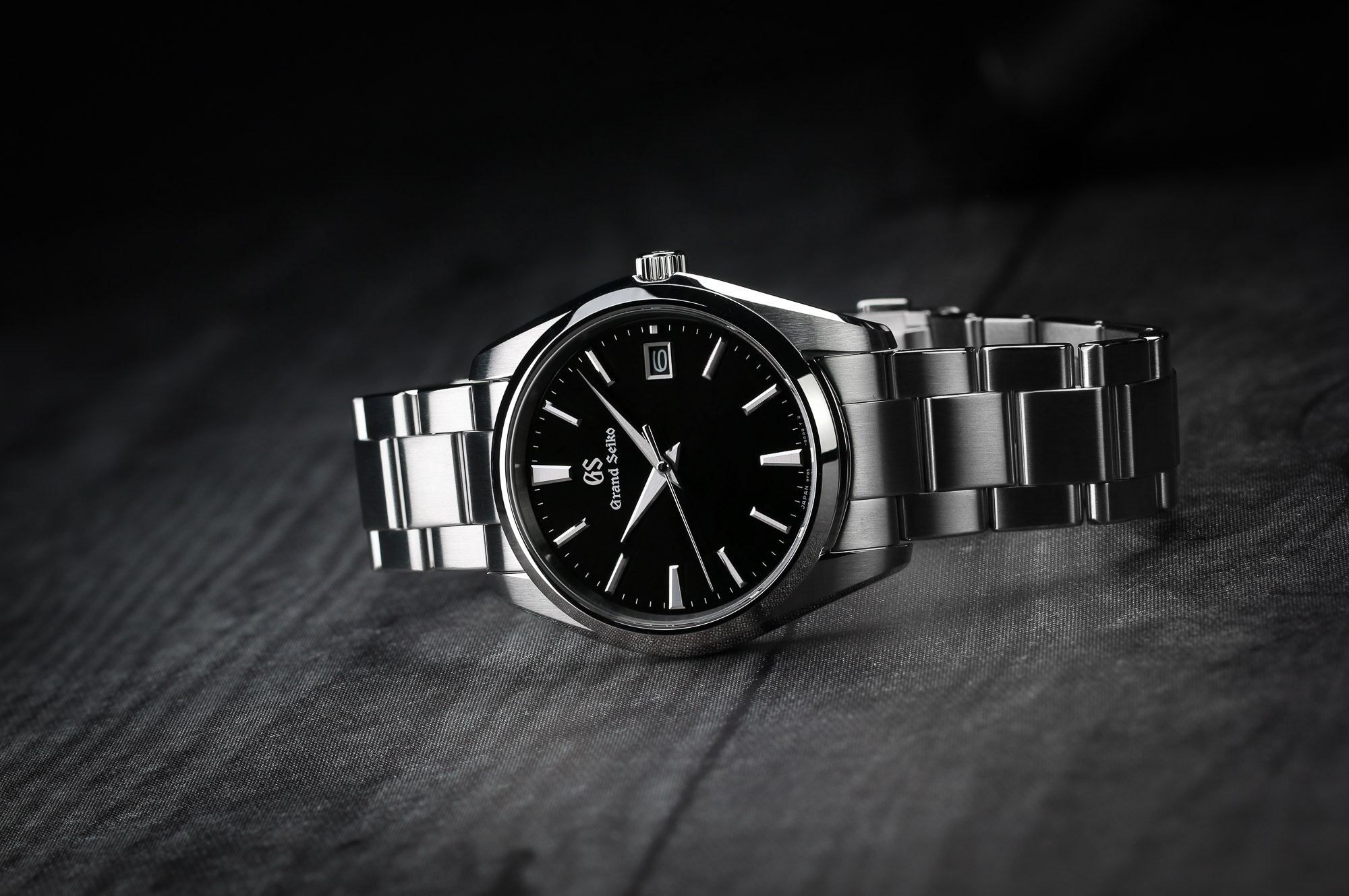 Grand Seiko SBGP011 stainless steel wristwatch with a black dial.