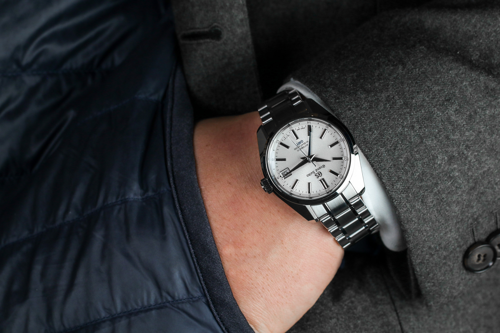 Grand Seiko SBGJ201 stainless steel watch on the wrist.