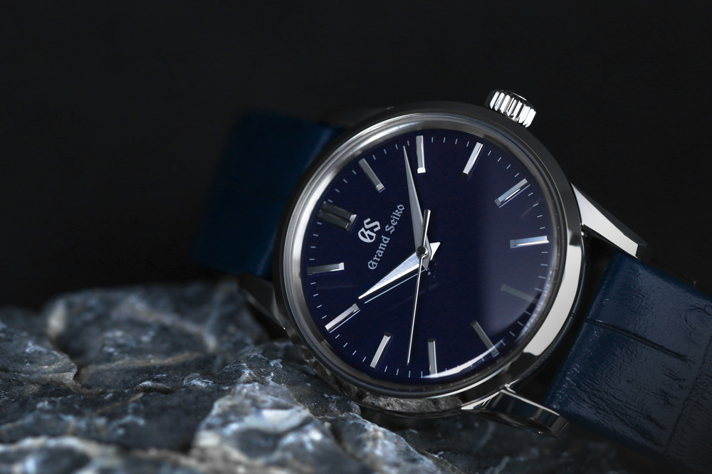 Grand Seiko SBGX347 white dial wristwatch for men and women.
