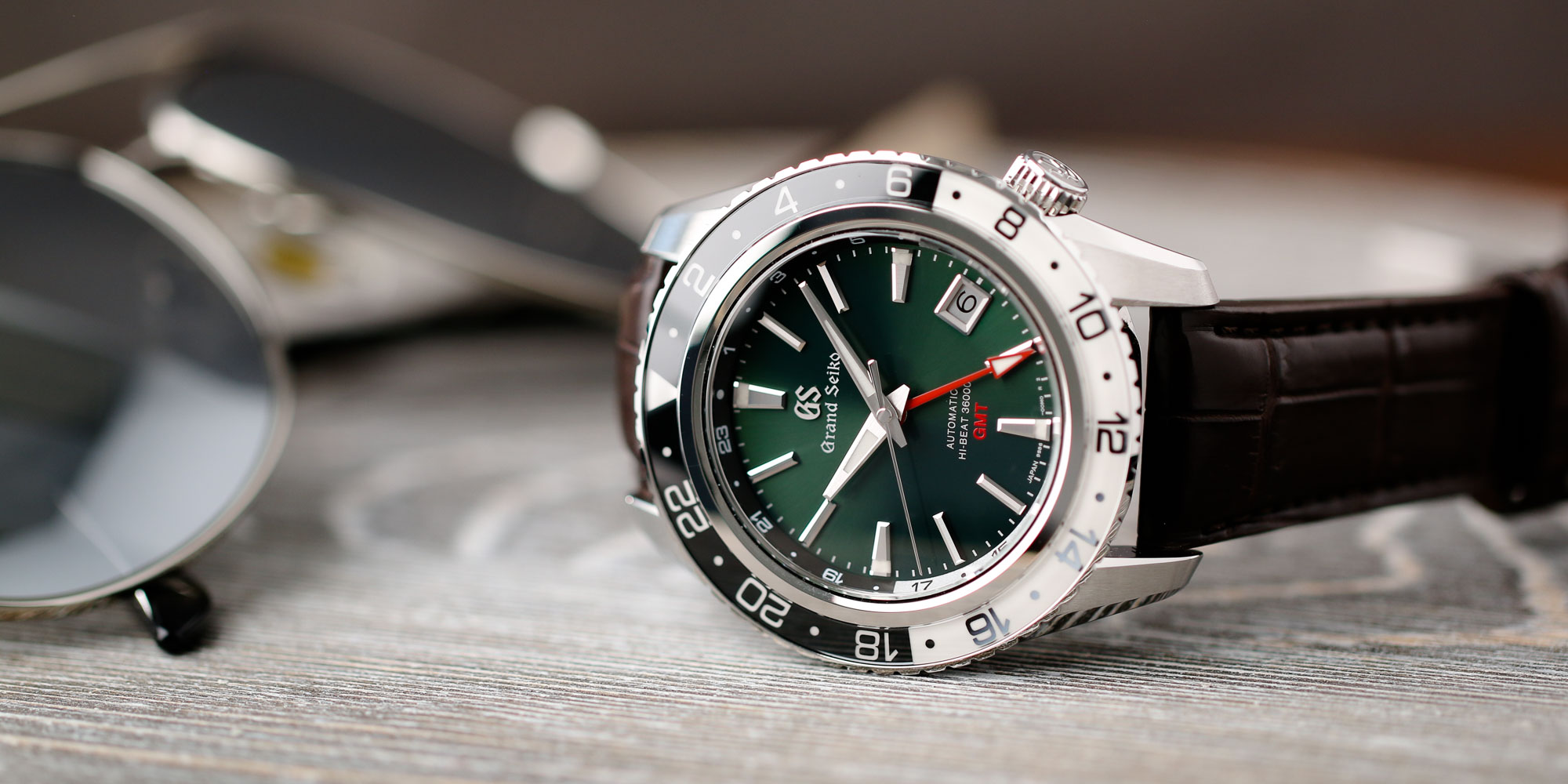 Grand Seiko SBGJ239 Hi-Beat GMT green-dial men's timepiece