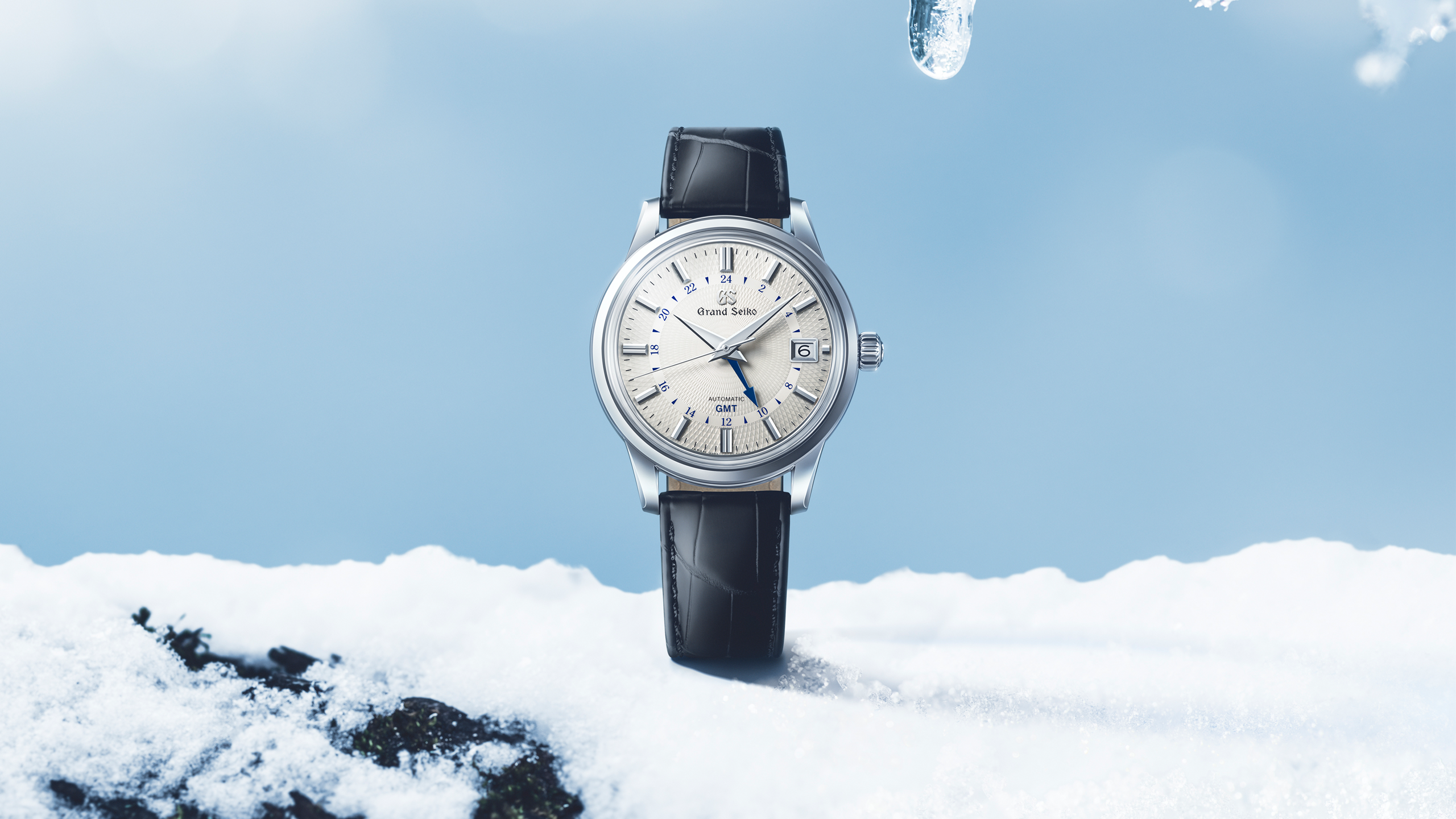 Frozen waterfall Jily Su in winter. Landscape of mountains with Grand_Seiko_Spring_Drive_GMT_SBG295-hero-thumbnail